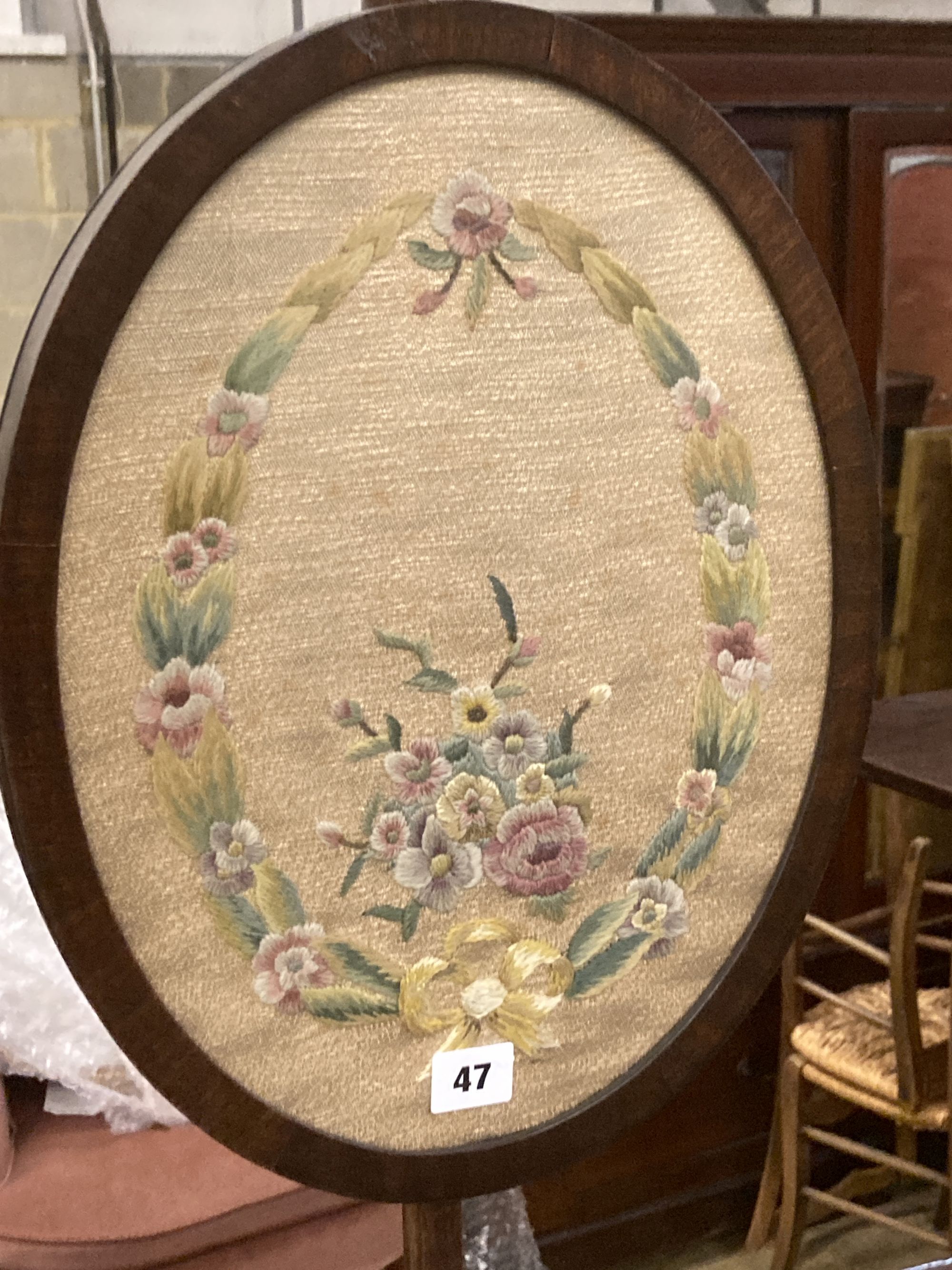 A Victorian mahogany pole screen, with oval tapestry banner, height 128cm